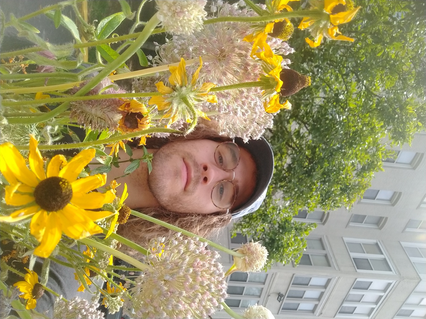 Andrew, holding a flower
